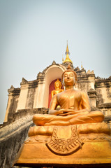 Fototapeta na wymiar Statue of golden ancient Buddha in Temple THAILAND
