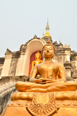 Statue of golden ancient Buddha in Temple THAILAND