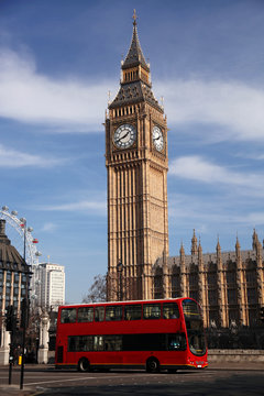 Big Ben with red double decker in London, UK