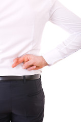 Business man with fingers crossed.