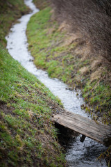 small stream in field