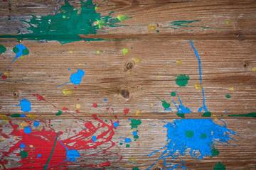 color splashes on wooden wall