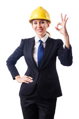 Young businesswoman with hard hat on white
