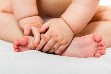 Obraz na płótnie Canvas Baby feet and hands