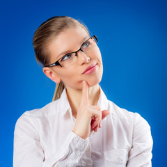 Beautiful blond female looking at SEO chart.