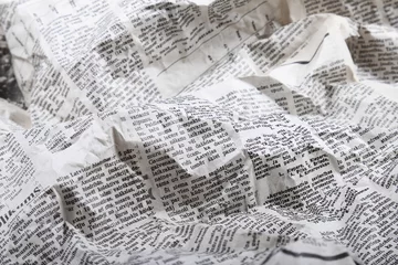 Abwaschbare Fototapete Zeitungen Hintergrund der alten zerknitterten Zeitung
