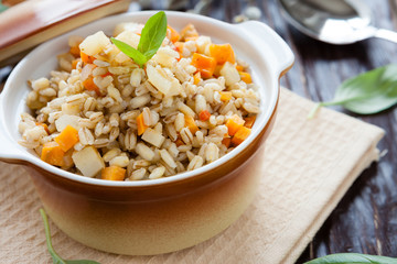 barley porridge with root vegetables in a pot