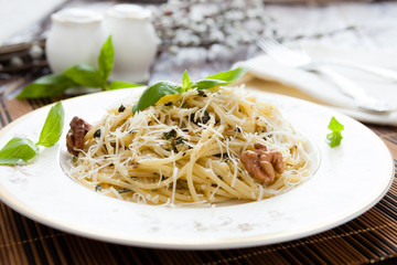 spaghetti with grated Parmesan and basil