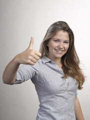 Happy Young Woman Showing Thumb Up Sign