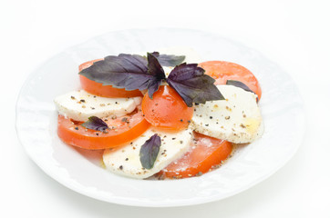 Caprese salad made with mozzarella cheese, tomatoes and basil