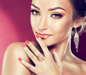 Model with Coral makeup and manicure