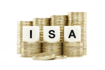 ISA (Individual Savings Account) on gold coins on white backgrou