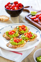 Crostini with avocado and tomato