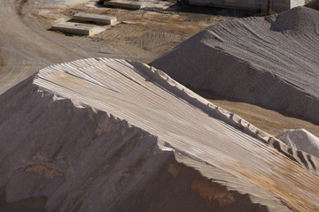 Heaps of aggregate in a rock quarry near Split in croatia