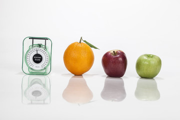 Fruits an weight scale isolated