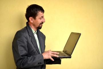 Business man holding a laptop