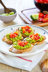 Crostini with avocado and tomato