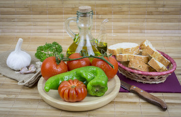 still life with olive oil,vegetables on wood table