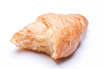 Fresh and tasty croissant over white background 