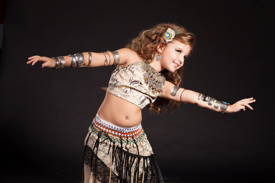 Little girl bellydancer dancing