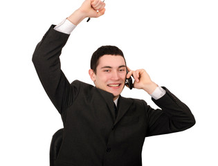 Naklejka premium Businessman with hand up receiving good news on the phone.