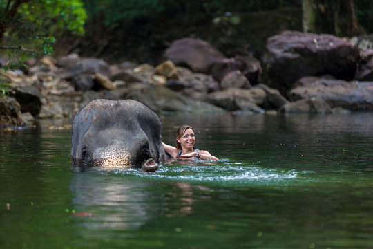 the girl with the elephant in the water