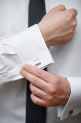 Cuff link, man is getting dressed