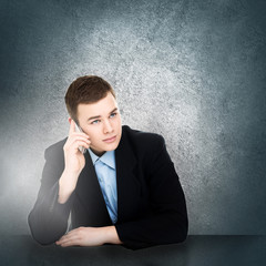 Modern young businessman talking on smartphone