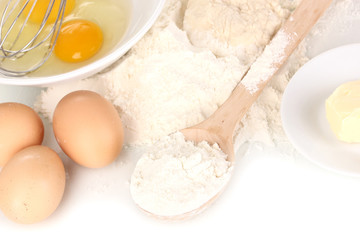 Eggs, flour and butter close-up isolated on white