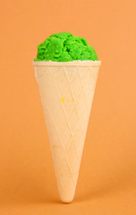 Scoop of the kiwi ice cream in the waffle cone