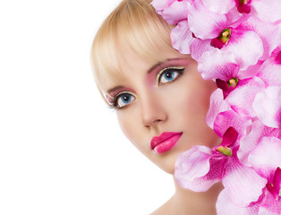 Beautiful girl with flowers and pink makeup