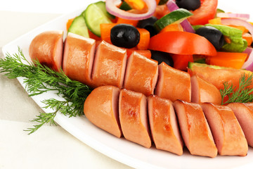 Grilled sausage with fresh salad close up