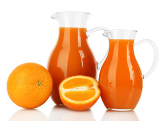 Orange juice in pitchers isolated on white