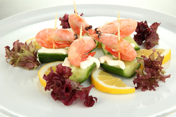 Small portion of food on big plate close up