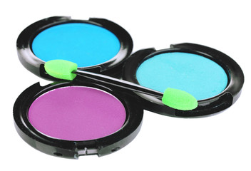 Bright eye shadows and sponge brushes for foundation isolated