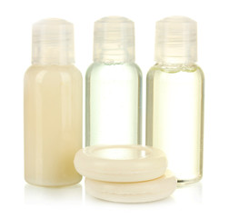 Fototapeta na wymiar Hotel cosmetic bottles with soap isolated on white
