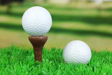 Golf balls on grass outdoor close up