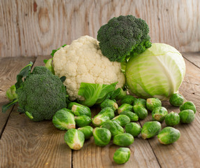 Still life with assortment cabbages on wooden background