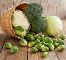 Still life with assortment cabbages on wooden background