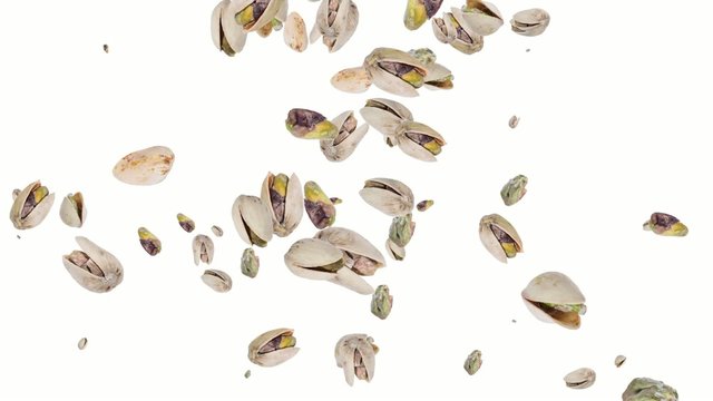 Pistachios falling down and forming a heart