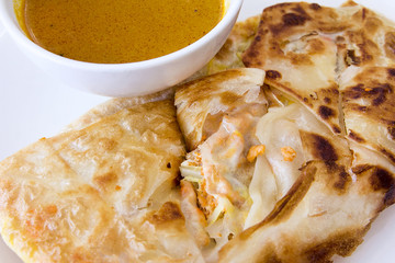 Indian Roti Prata with Curry Sauce Closeup