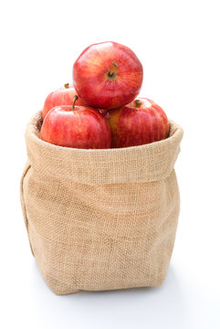 Fresh Apples In Gunny Bag On White