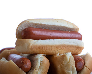 A stack of hotdogs and buns on a white background