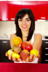 Woman holding Fruits