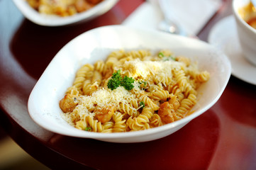 Delicious pasta on white plate