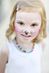 Adorable little girl with painted face