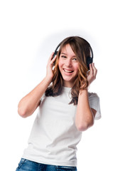 Naklejka premium Beautiful girl listening to music on headphones