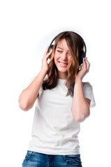 Beautiful girl listening to music on headphones