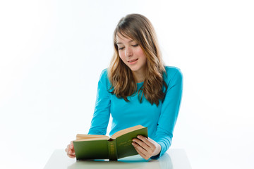 Small and beautiful girl reading a book