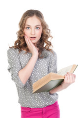 Small and beautiful girl reading a book